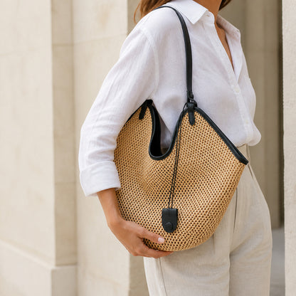 Odile Woven Tote in black carried on the shoulder