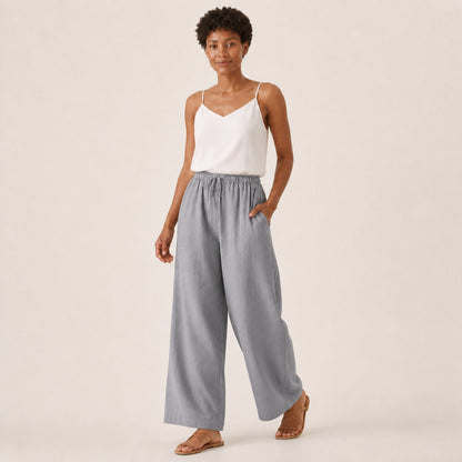 Remy Linen Wide-Leg Trousers in grey, three-quarter view in movement