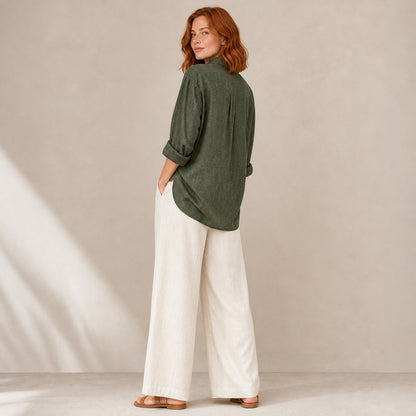 Isla Linen Shirt in army green, back view showing the longer dipped hem
