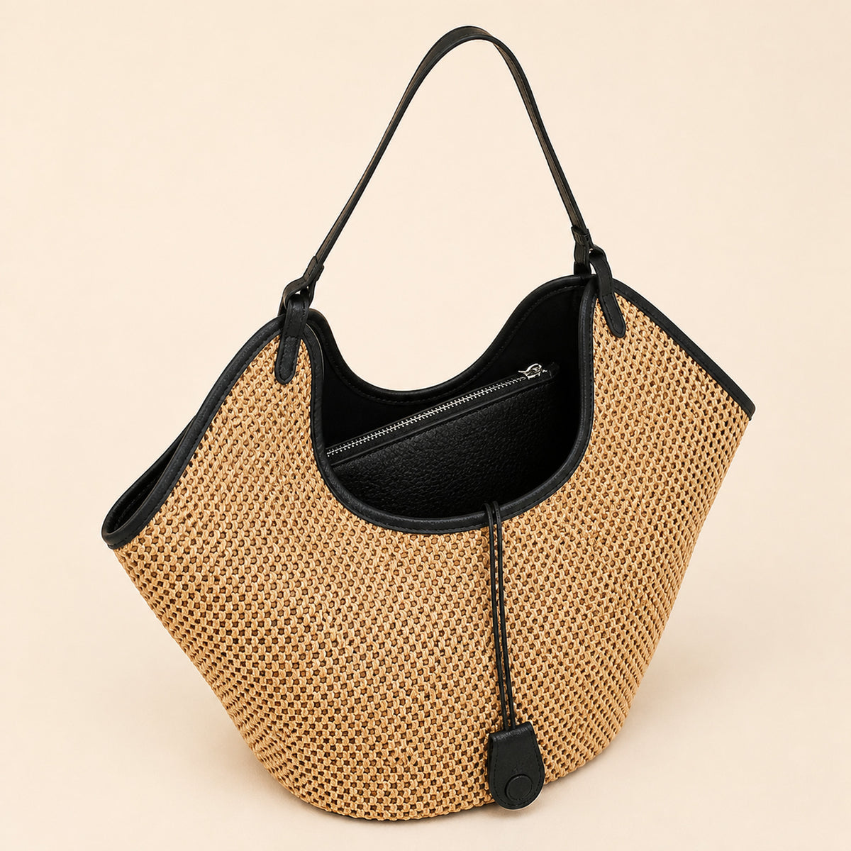Odile Woven Tote in black, open to show the lined interior