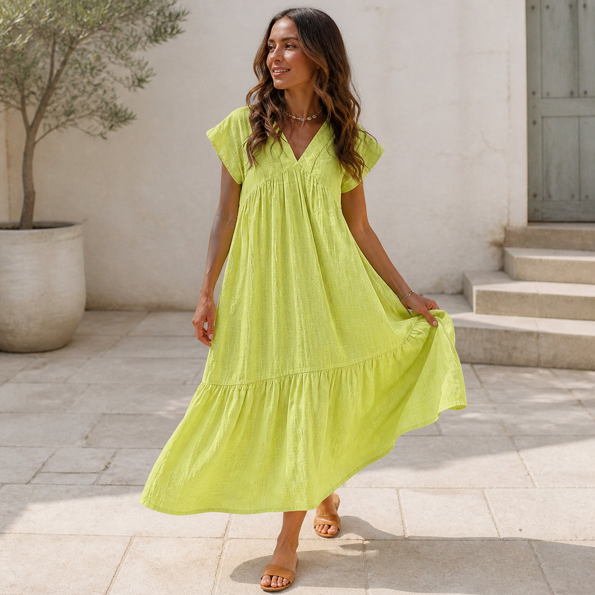 Willow Tiered Sundress in yellow, worn in movement showing the full hem