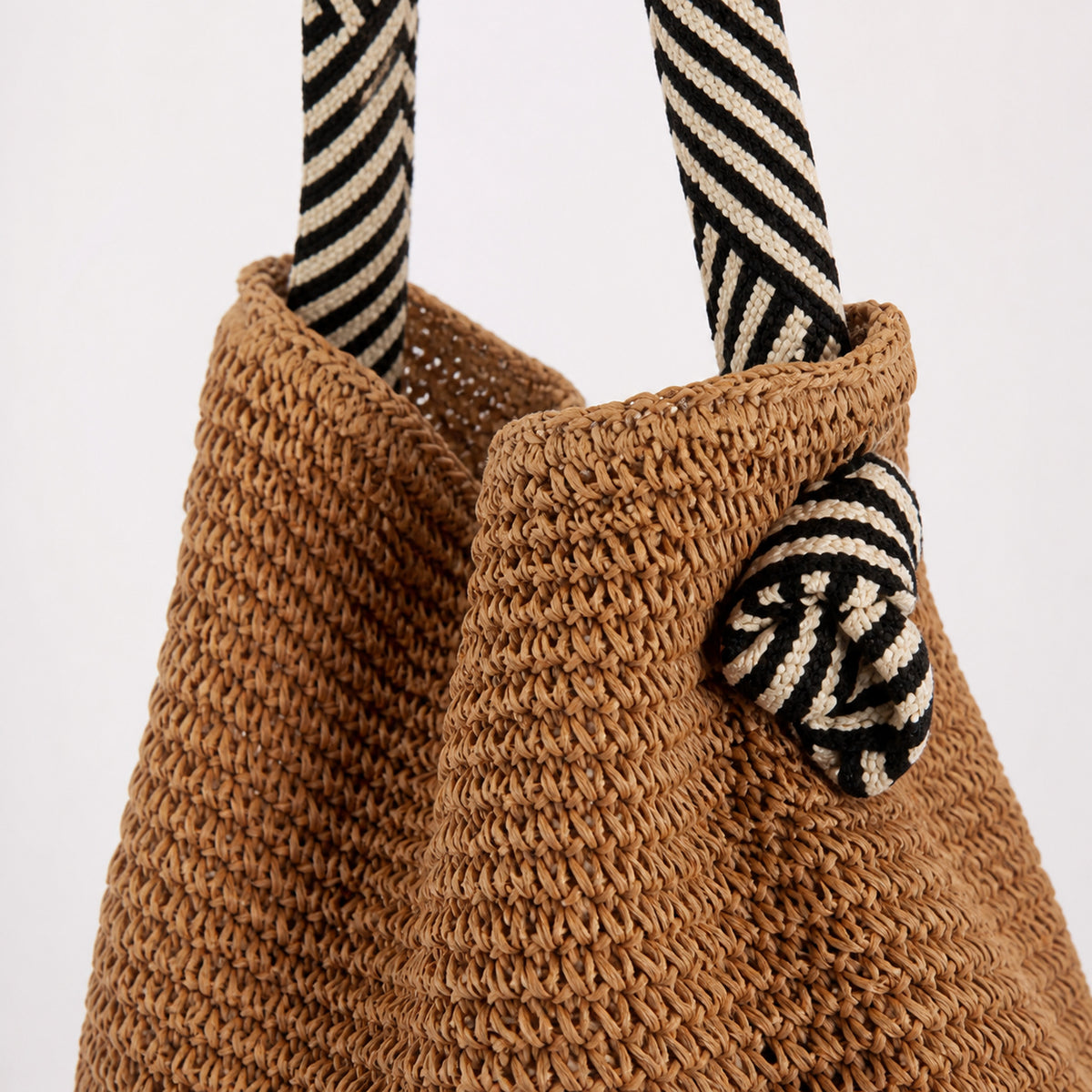 Close-up of the crochet strap on the Monaco Straw Tote