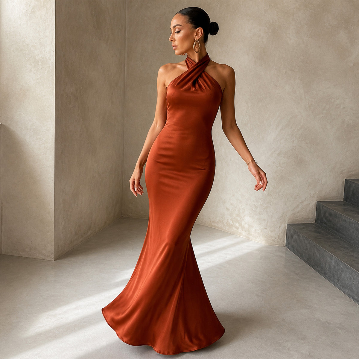 Seraphina Fishtail Maxi in dark orange, worn in movement showing the flared hem