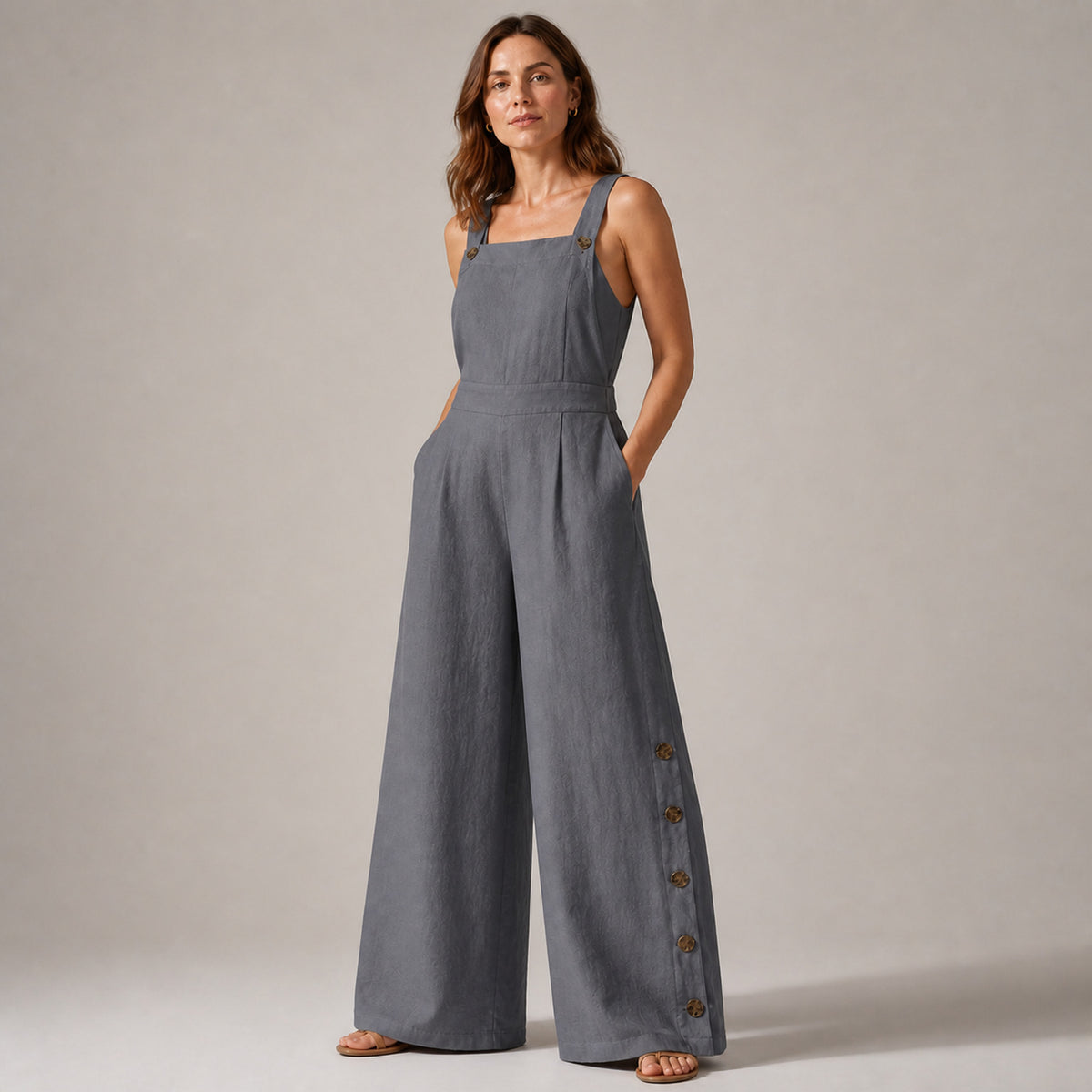 Close-up of the bib front and side buttons on the Frankie jumpsuit
