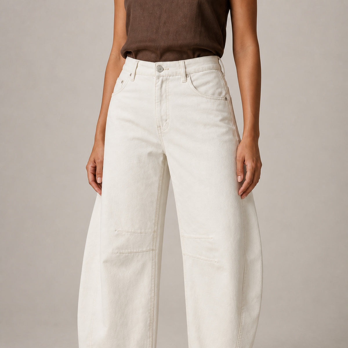 Close-up of the waistband and denim on the Agnes Barrel Jeans