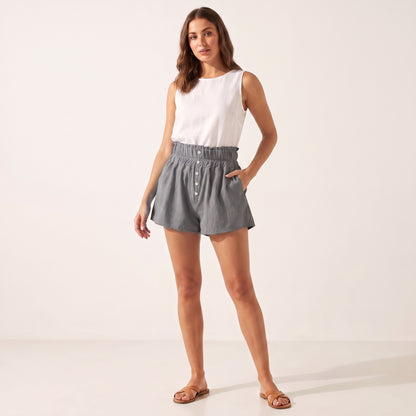 Posy Linen Shorts in grey worn with a white vest, front view