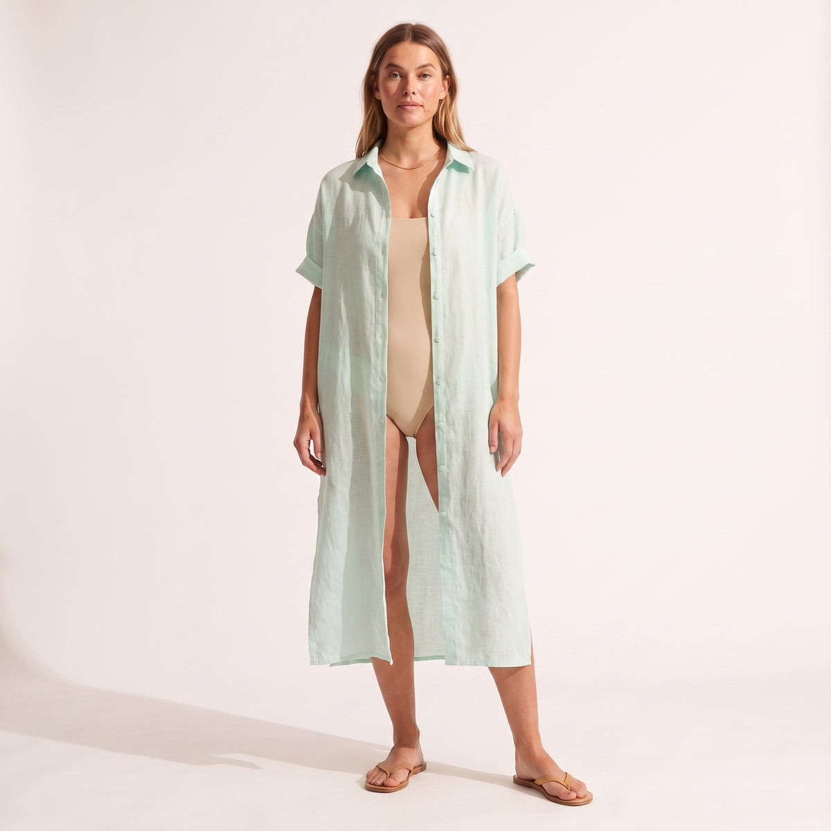 Maeve Oversized Linen Dress in mint green worn open over swimwear as a cover-up