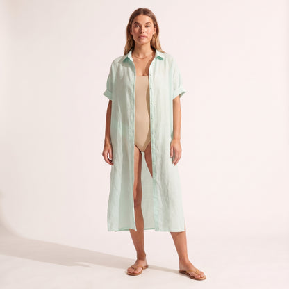 Maeve Oversized Linen Dress in mint green worn open over swimwear as a cover-up